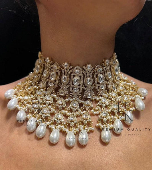 Gold plated tyani kundan necklace set stunned with ad stones with earrings